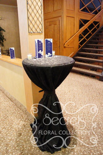 cocktail table wrapped in black brocade linen cake table with