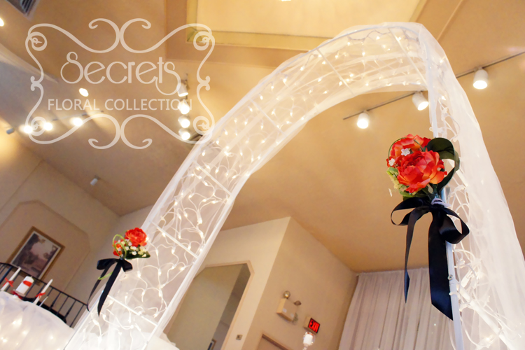 A Red Black And White Ceremony And Reception Decoration