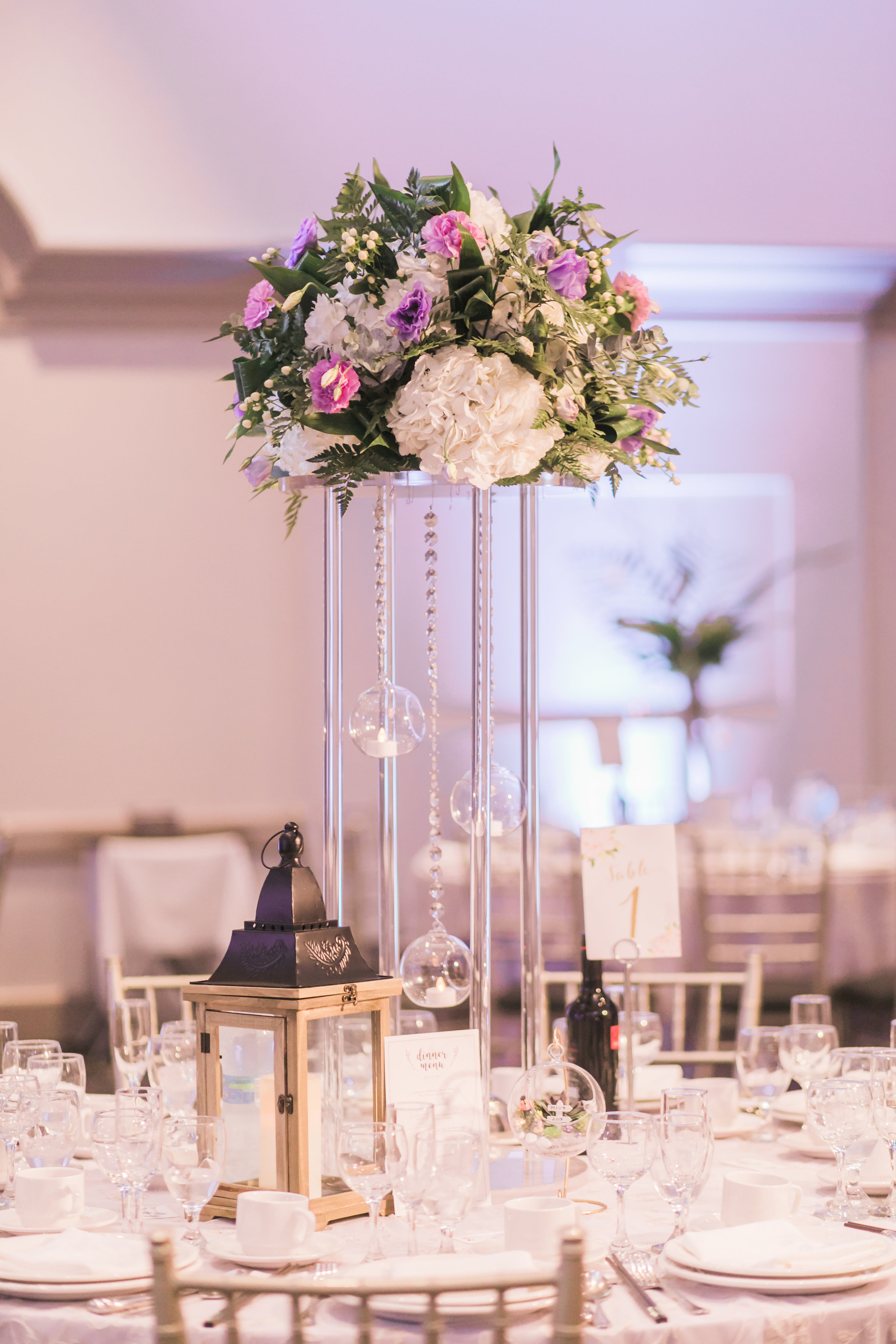 Toronto Wedding Flowers And Decor By Secrets Floral Fresh Tall Centrepiece Arrangement With Cream Hydrangea Purple Lisianthus Greenery Toronto Wedding Flowers And Decor By Secrets Floral Fresh Tall Centrepiece Arrangement With Cream Hydrangea Purple Lisianthus Greenery